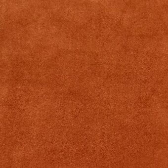 Suede-like fabric texture in sunstone orange with tonal variations, dense short pile, matte finish, and subtle identifying text.
